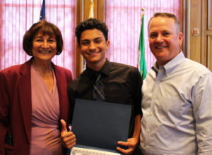 2019 Worcester Youth Leadership Institute Graduate Xavier Aviles poses with Dr. Mattie Castiel, City of Worcester's commissioner of Health and Human Services, and Timothy P. Murray, president and CEO of the Worcester Regional Chamber of Commerce, upon receiving his certificate. Photo by Dominique Goyette-Connerty.