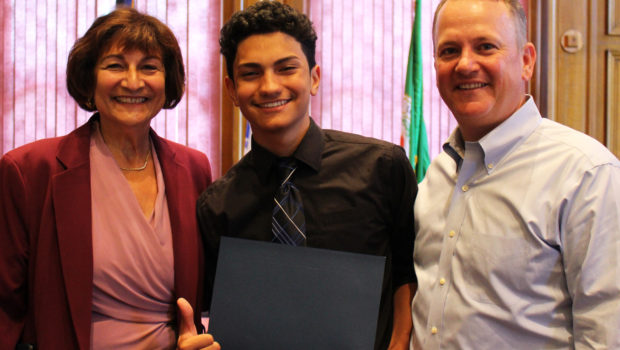 2019 Worcester Youth Leadership Institute Graduate Xavier Aviles poses with Dr. Mattie Castiel, City of Worcester's commissioner of Health and Human Services, and Timothy P. Murray, president and CEO of the Worcester Regional Chamber of Commerce, upon receiving his certificate. Photo by Dominique Goyette-Connerty.