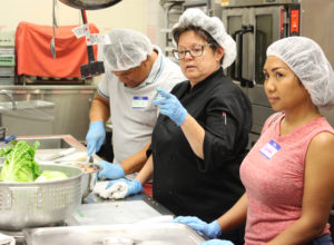 In late July, an instructor guides participants in the Worcester Regional Food Hub's Launching Diverse Food Entrepreneurs in Worcester program. / PHOTO BY EMILY GOWDEY-BACKUS