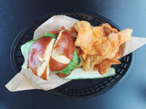 A buffalo chicken schnitzel sandwich - topped with a whole jalapeno popper - is listed a must-order at $14. / PHOTO BY EMILY GOWDEY-BACKUS