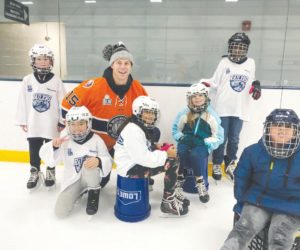 Railers staff and team members interact with WPS students during a recent Skate to Success session. / PHOTOS COURTESY WORCESTER RAILERS.
